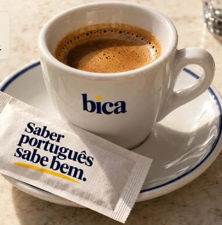 A small coffee on a marble table in the sun.